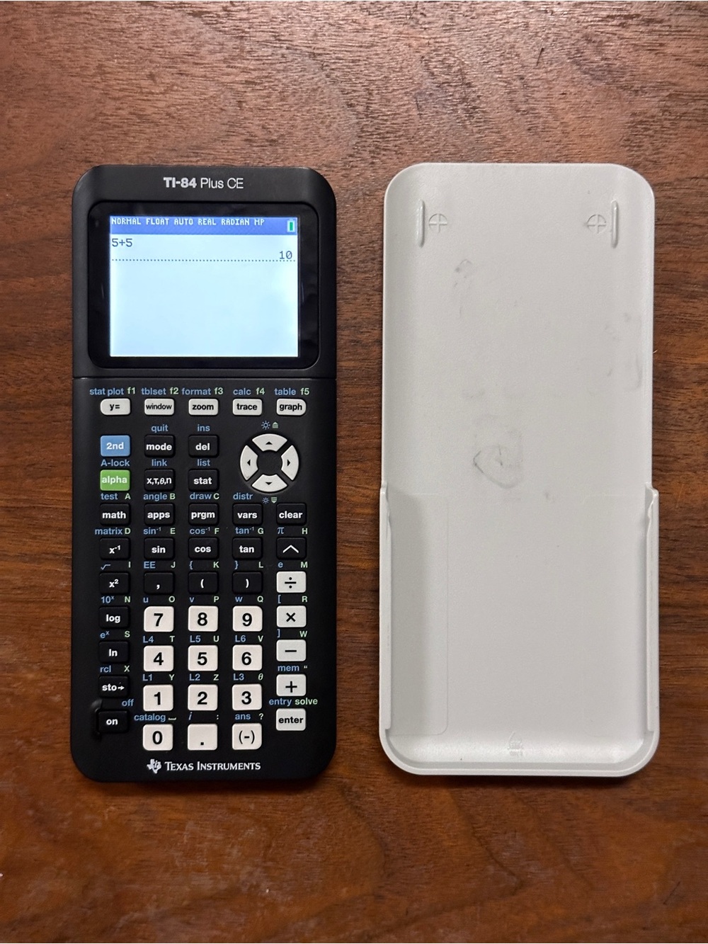 Texas Instruments TI-84 Plus CE Graphing Calculator - Black with White Cover